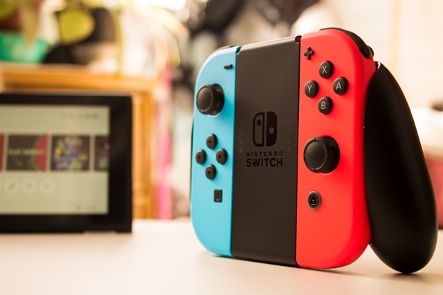 Featured refurbished electronics collection banner showcasing a close-up of a classic Nintendo Switch console with neon blue and red Joy-Con controllers.
