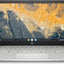 HP Chromebook with a scenic wallpaper on the screen