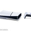 White gaming console and controller on a white background