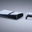 Gaming console and controller on a gray background