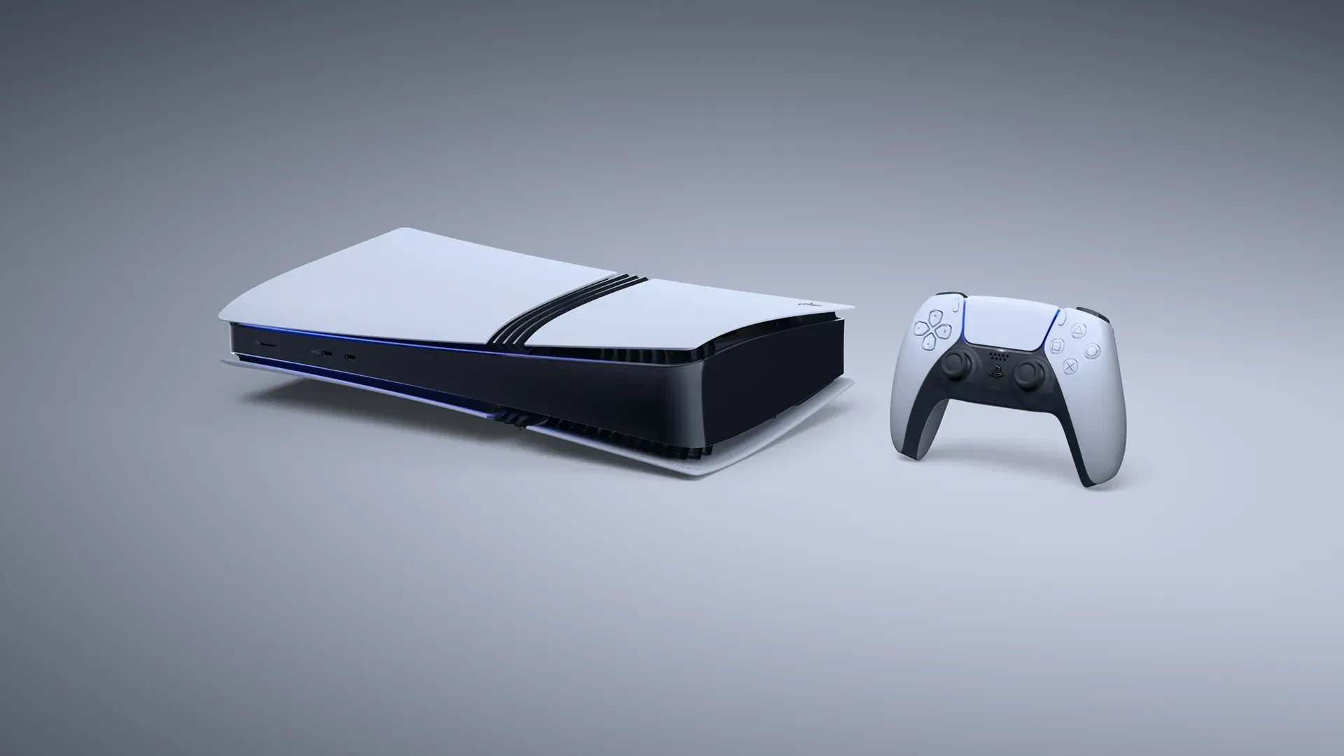 Gaming console and controller on a gray background