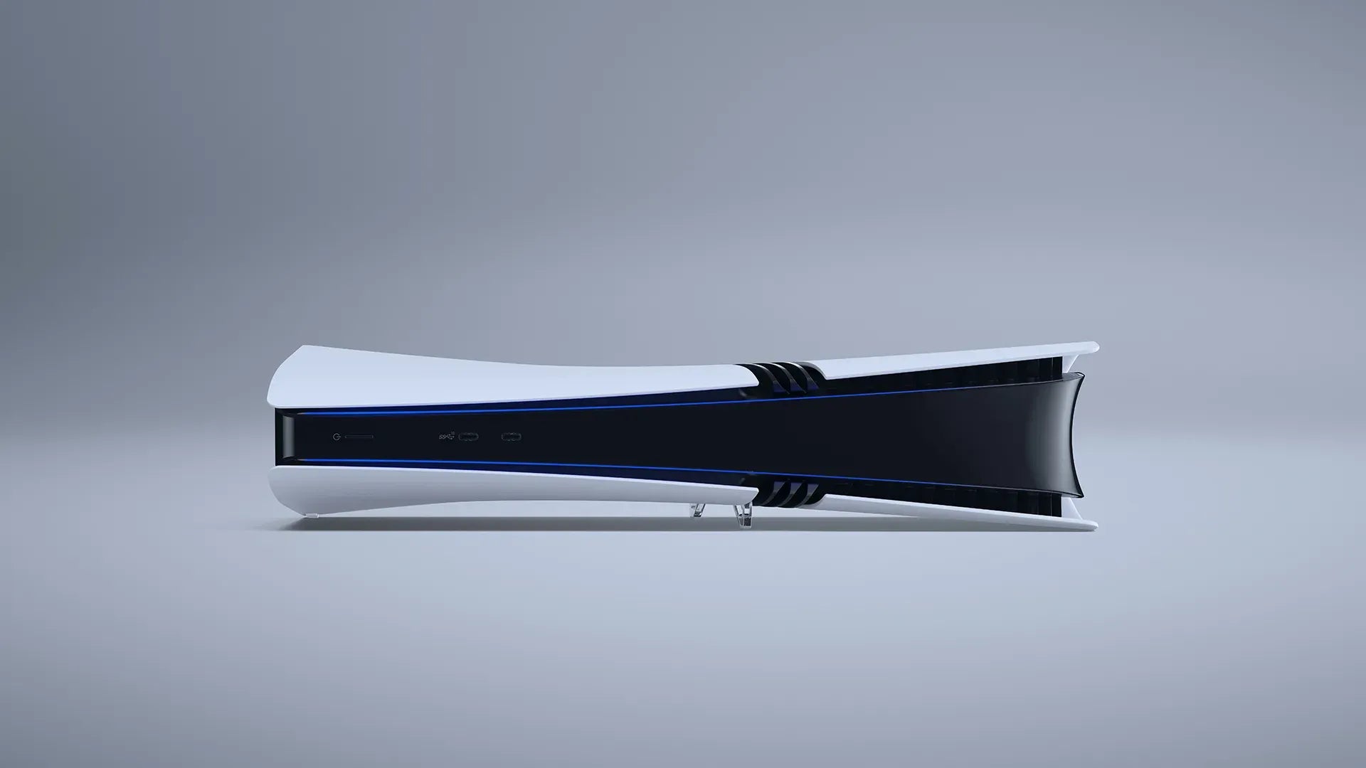 Glossy white gaming console with black accents on a gray background