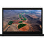 Laptop displaying an aerial view of a landscape with fields and roads on the screen.