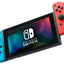 Nintendo Switch console with blueJoy-Con and redJoy-Con on a white background